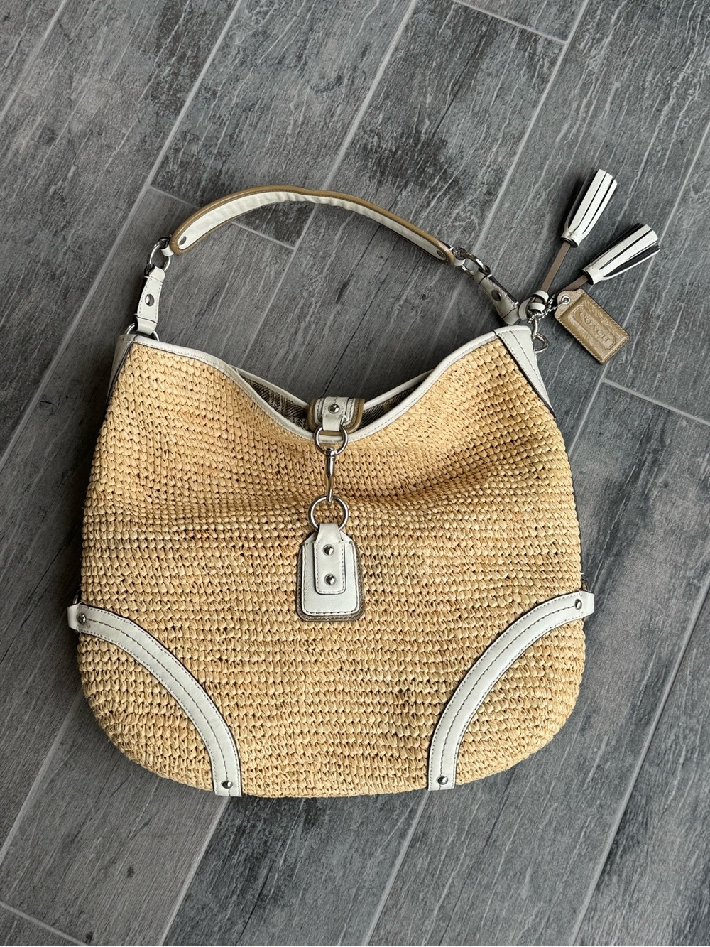 Vintage Coach straw hobo bag featured in a slouchy silhouette